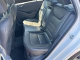 the back seats of a car are empty and the passenger seat is empty