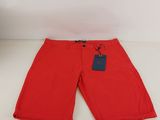 the children ' s shorts are red and have a tag on it