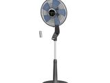 un ventilateur noir et blanc posé sur un support métallique