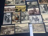 a lot of old photos on display on the table