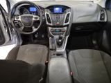 the interior of a car with a steering wheel, dashboard, and dashboard controls