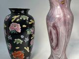 three vases sitting next to each other on a white surface