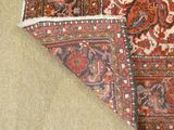 an image of a rug on the floor with a cat laying on top of it