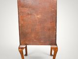 an old wooden table with a metal top and legs