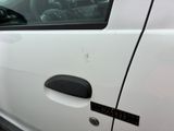 a white car with a sticker on the side of it