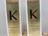 two bottles of kerastasee hair oil sitting on top of a basket
