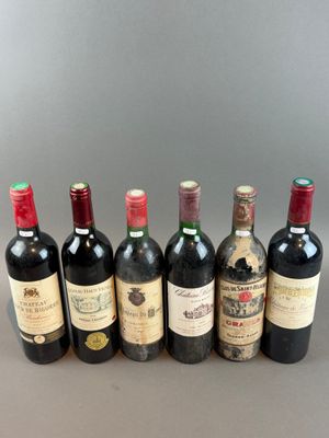 six bottles of wine lined up in a row on a table