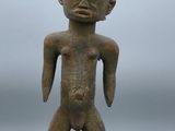 a small statue of a man with a large body