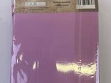 a close up of a package of purple paper on a white surface