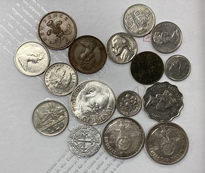 a lot of coins that are sitting on a piece of paper
