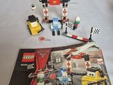 a lego book with a picture of a race track and cars