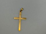 une croix dorée sur fond gris
