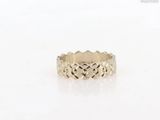 a gold ring with a heart design on it