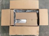 a box with a laptop inside of it on the floor