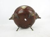 an image of a brown ball with four legs and a heart on it