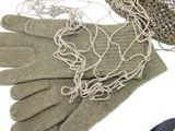 a pair of gloves and a net on a table