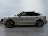 the porsche cayense is parked in a white room