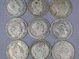 six different british silver coins, one of which has a crown on it