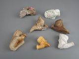 a lot of small pieces of pottery on the table