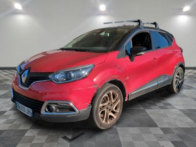 the red car is parked on a checkered floor in the garage