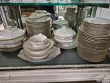 many plates and bowls stacked on top of each other