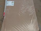 a mattress that is sitting on the floor in the warehouse
