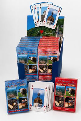 a box of playing cards with a picture of a castle in the background