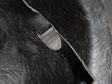 a close up of a black hat with a leather band