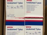 three boxes of leukomed tplus are stacked on top of each other