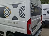 a white van that is parked in a parking lot