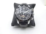 a watch that is sitting on a pillow on a table