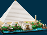 a lego model of a pyramid with a boat in front of it