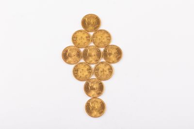 une image représentant une croix composée de pièces d'or sur fond blanc