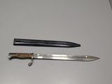 a knife and a knife holder sitting on a table