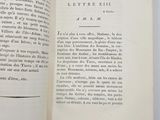 a close up of a book open to a page with a black and white image