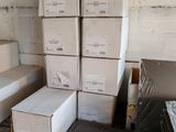 many boxes and boxes on a shelf in a room