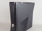 a video game console sitting on a table with a remote