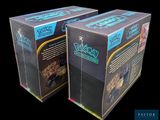 two boxes that are sitting side by side on a black background