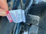 a person that is holding a ticket in their hand