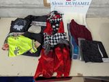 a table with a lot of clothing on it