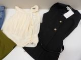 three pieces of clothing sitting on top of a table next to each other