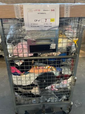 a metal cart with a lot of clothes in it