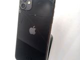 a broken iphone sitting on top of a stand