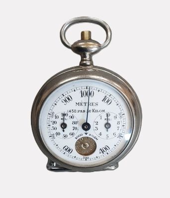 a close up of a pocket watch on a white background