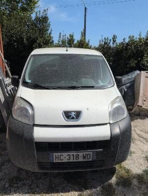 a white van that is parked in the dirt