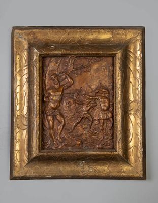 une image représentant une plaque en bronze sur laquelle figurent un homme et une femme