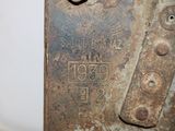 a rusted piece of metal with the words boston on it