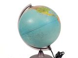 a small blue and green globe on a metal stand
