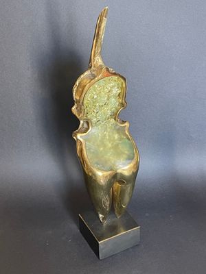 bronze sculpture of a bird on a pedestal on a gray background