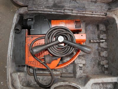 a tool in a tool box with a hammer and other tools